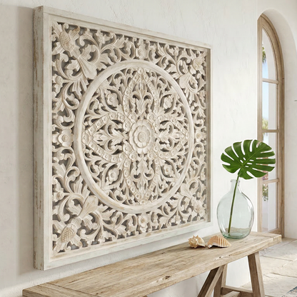 Decorative wall panel in a living room with a couch and plants