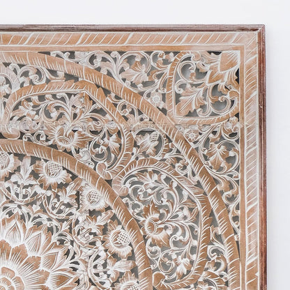 Close-up of a wooden panel with intricate carvings on a white background